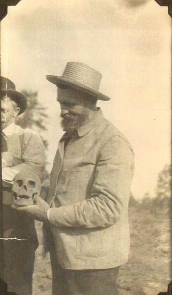 File:0000-clayton-018b-man-with-human-skull-1600.jpg